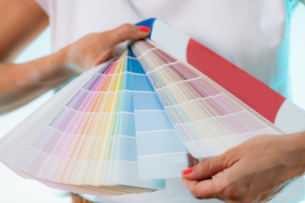 Designer Choosing Colors from Color Palette.